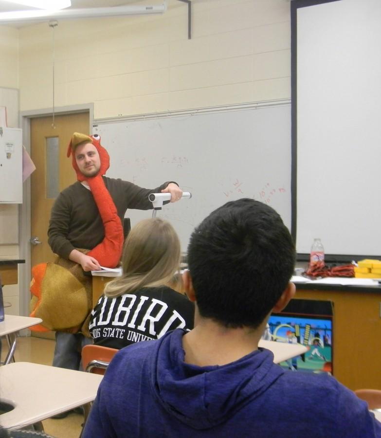Physics teacher Robert Beal won the contest to wear the turkey suit two years in a row. 