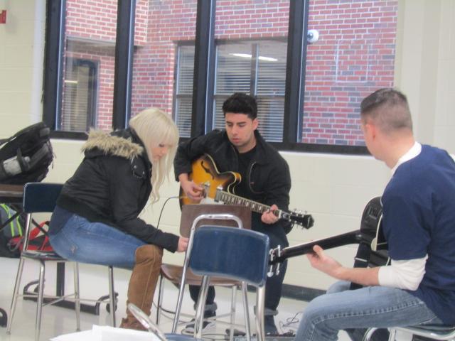 Staff and students gathered in the commons for the first Tunes with the Cat. Senior Amber Stump performed along with junior Renato Sosa and   English teacher Nick Kempski who played their guitars.