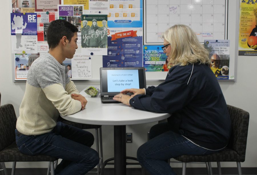 Counselor Mary Roley helps senior Jacob Resendiz at the college career center. Students are now able to get help with college preparations rather than doing it all on their own. 