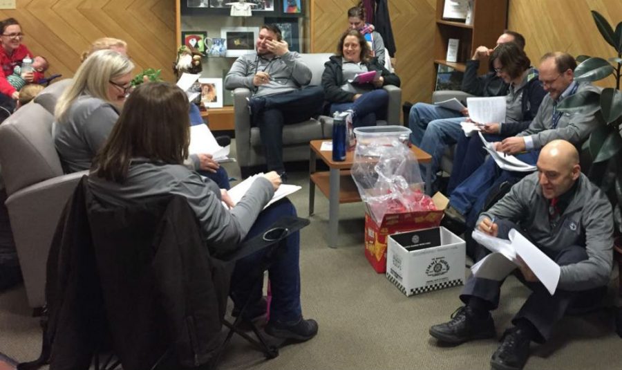 Teachers grade and converse during their grade-in on Wednesday at the district office in West Chicago. 