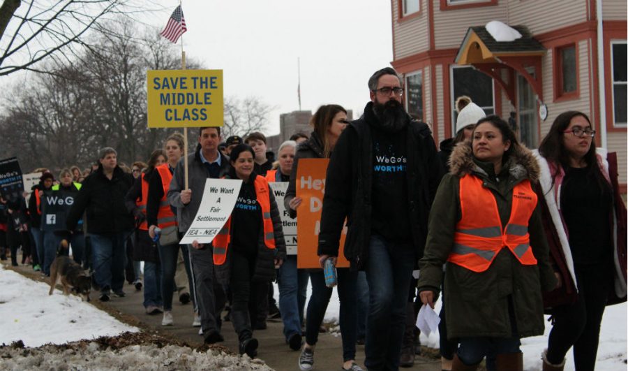 West Chicago Teachers Association members, students, and community members march to the district office on Thursday to support their bargaining team.