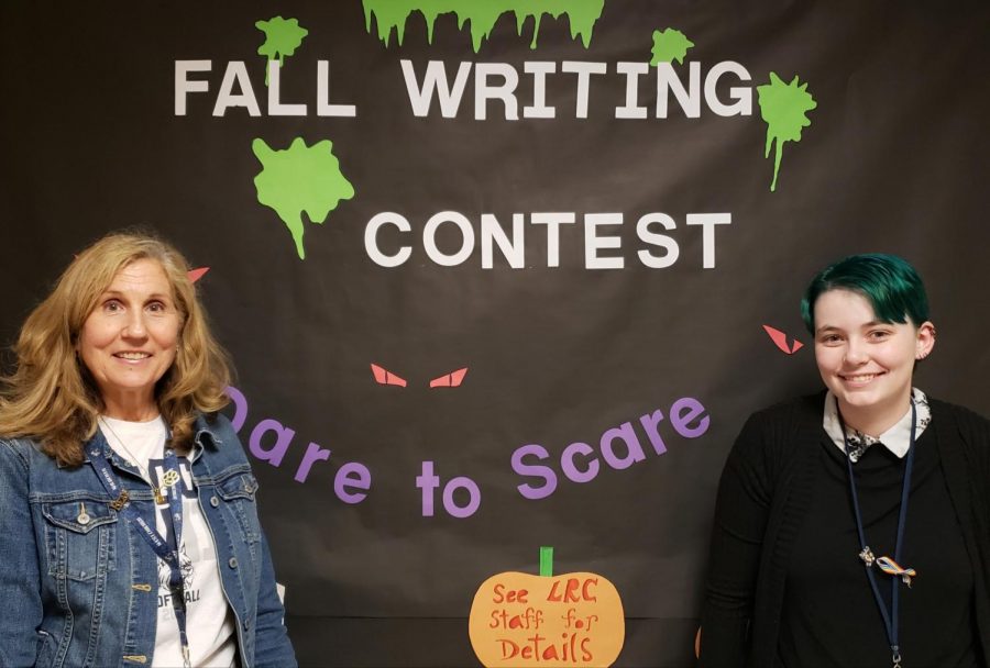 Library media specialist Donna Leahy (left) presents Dare to Scare on Oct. 24. LRC clerk Donna Kubica designed the poster. 