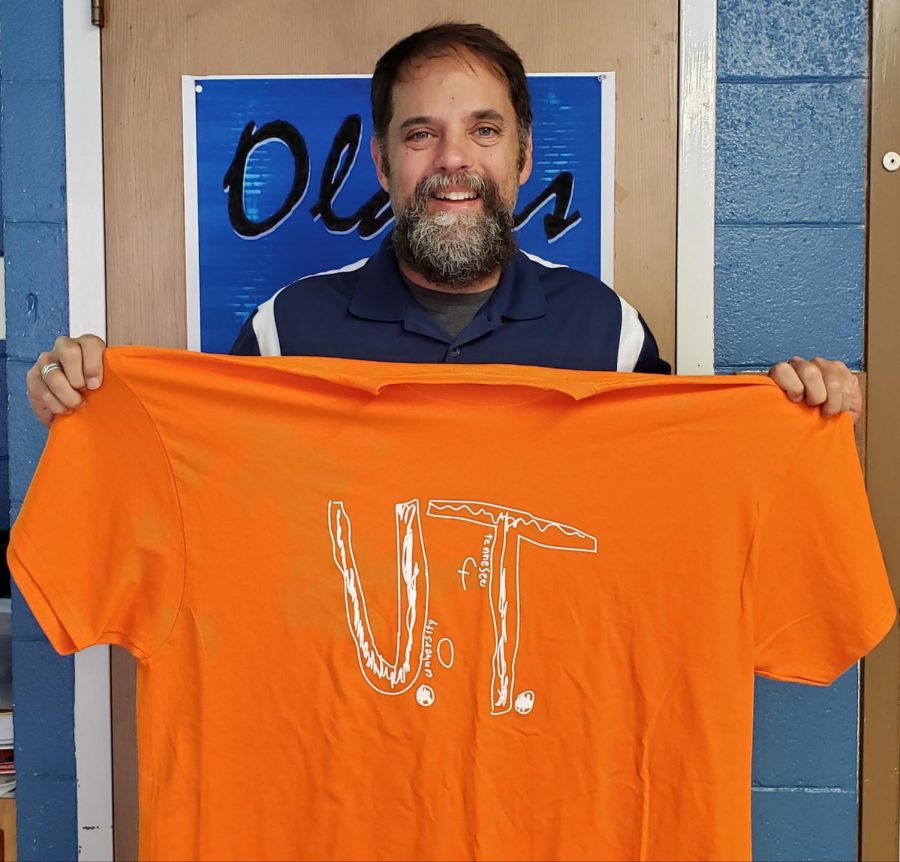 ESL teacher Mark Poulterer along with other teachers wore the University of Tennessee shirts on Wednesday to support a boy that was bullied after designing this shirt on paper and wearing it pinned to his shirt. 