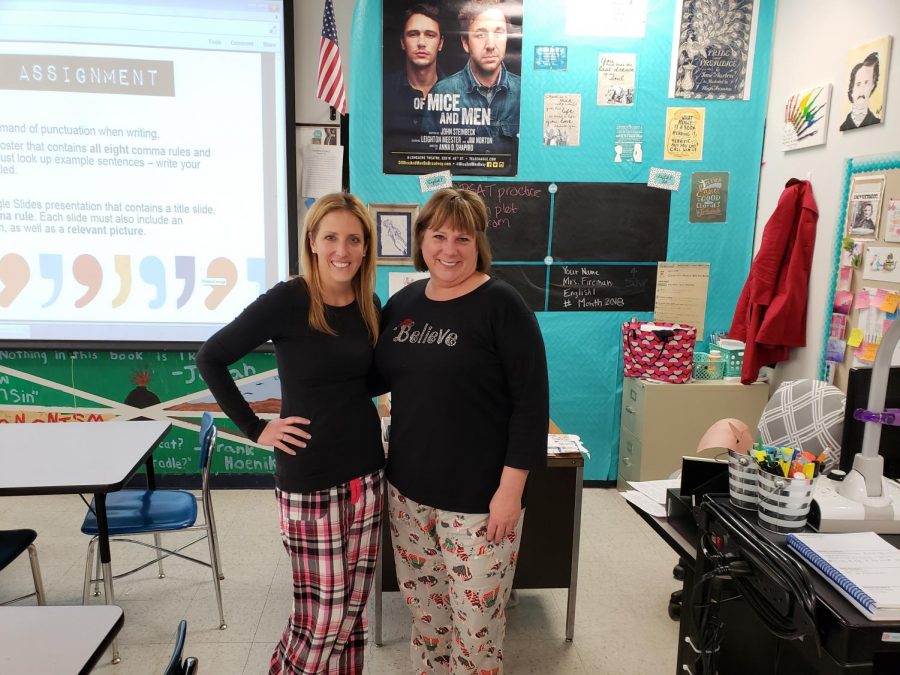 Fireman poses with co-teacher Cat Thielberg on pajama day.
