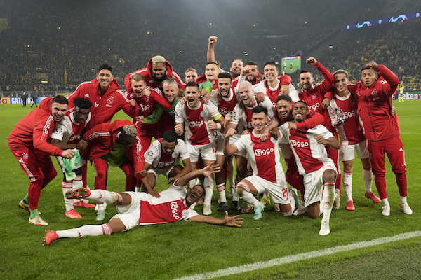 Ajax players celebrate at the end of the Champions League group C soccer match between Borussia Dortmund and Ajax Amsterdam in Dortmund, Germany, Wednesday, Nov. 3, 2021. Ajax won 3:1. (AP Photo/Martin Meissner)