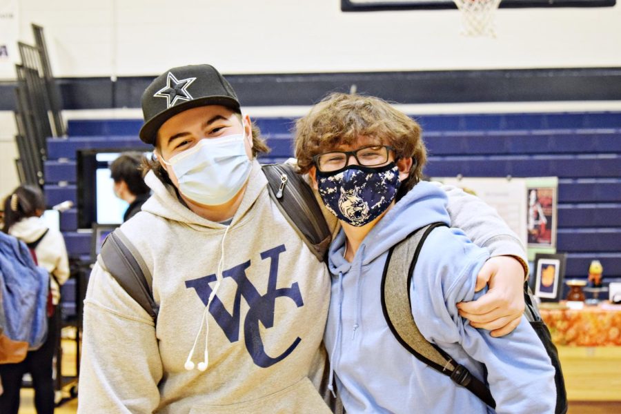 Sophomores Joey Engstrom and Ryan Zalak don masks at the curriculum fair in December.