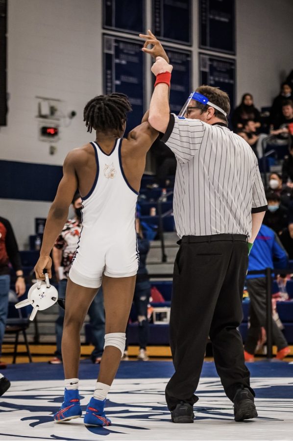 Team captain Baldwin celebrates another victory during the 2021-22 wrestling season.