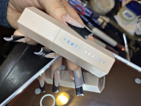 Beige matte Fenty Contour Skinstick with the brands name on the side.