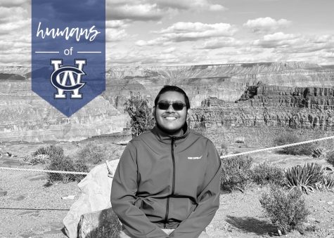 Junior Milan Christian, an avid traveler, sits on the edge of the Grand Canyon.