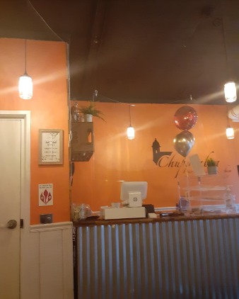 The interior of the restaurant, with homely orange walls, lights inside glass bottles, balloons and plants completing the picture to make sure the customers feel comfortable
