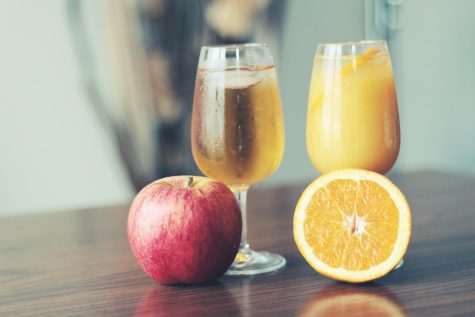 The debate between apple and orange juice is a long-standing one. (Royalty-free photo by JÉSHOOTS via Pexels.com)