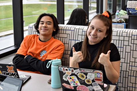 Seniors Fernan Reyes and Courtney Roxas represent the upperclassman by wearing orange and black during Class Color Day. 