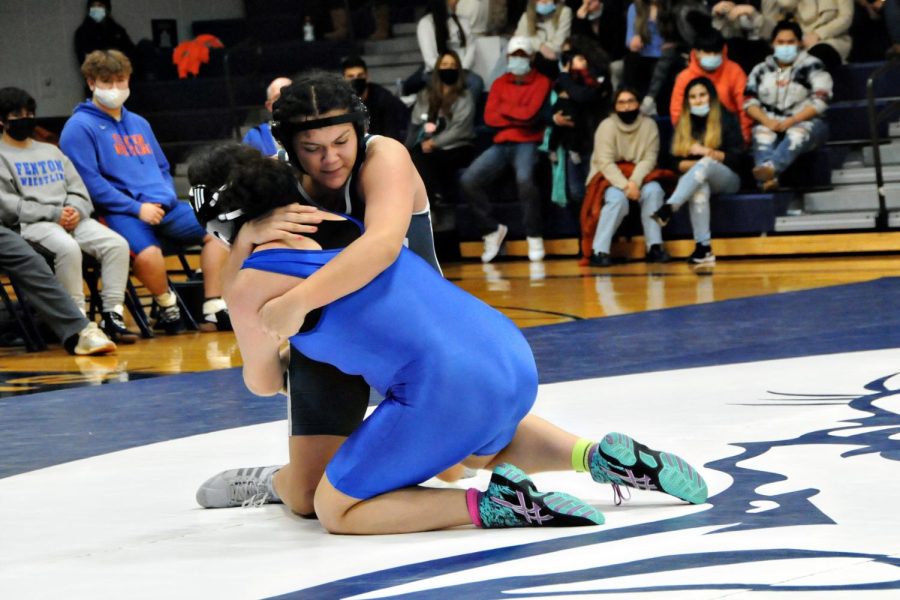 Huesca-Rodriguez pins an opponent during a meet last year.