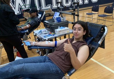 Senior Effie Giannoudakos donates blood during the October drive.