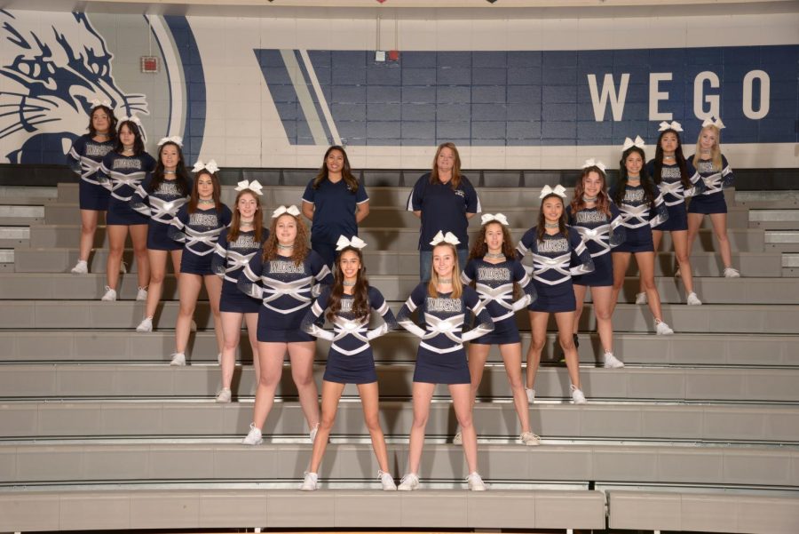 The competitive cheer team in formation in Bishop Gym. (Photo courtesy of Lifetouch)