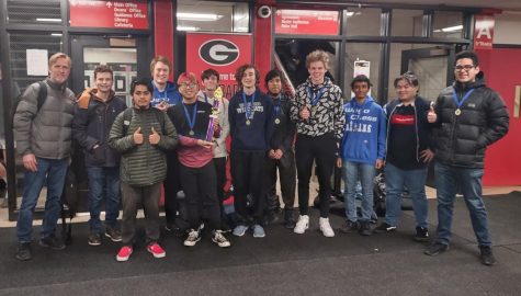 The chess team, with their new coach Paul Kash, after their win at the UEC conference championship. (Photo courtesy of Paul Kash)