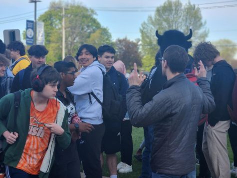 Students and staff stand outside of Entrance B after the fire alarm on May 1.