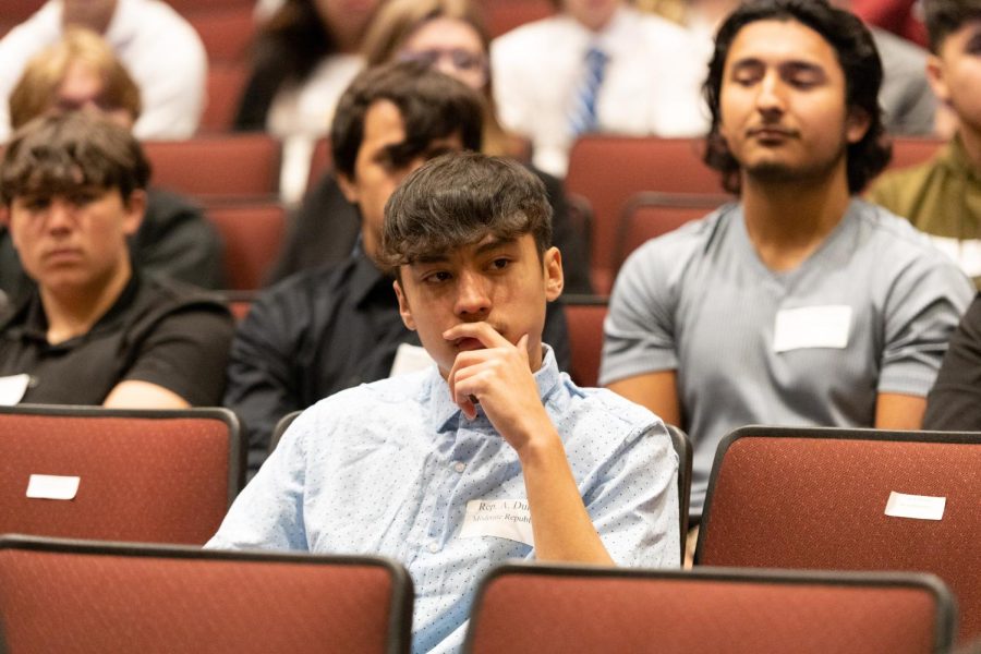 Senior AJ Durbin awaits the next speech during the full session in April 2023. )(Photo courtesy of Lifetouch)