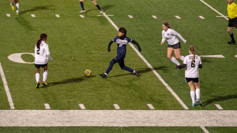 Daisy bringing the ball up the field at the home stadium against Glenbard North. 