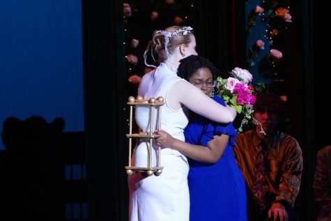 Senior Ellie Hurley and sophomore Sentia Irakoze embrace at the end of the musical. (Photo courtesy of Mark Begovich)