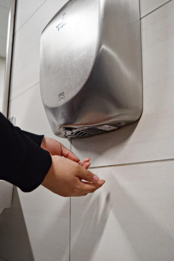 While efficient, the hand dryers in the restrooms may spread germs, and create a lot of noise. (Photo taken when no other students were in the restroom)