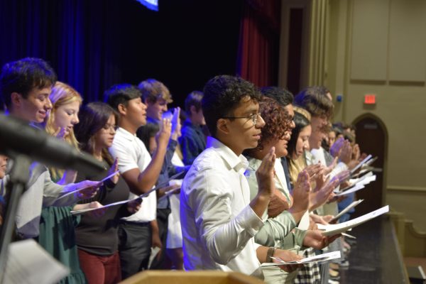 Inductees recite the National Honor Society pledge during the ceremony on Sept. 24 in Weyrauch Auditorium.