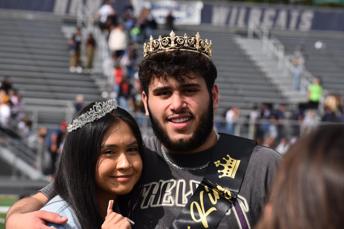 Karen Huerta Garnica and Qssam Alwan, the 2023 Homecoming queen and king, smile for the camera.