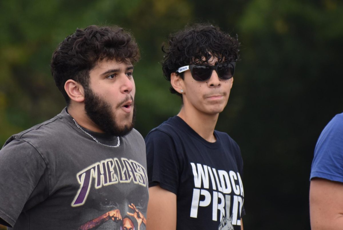 Seniors Qssam Alwan and Fabio Piloni, both Chronicle reporters, await the results of the Homecoming court vote.