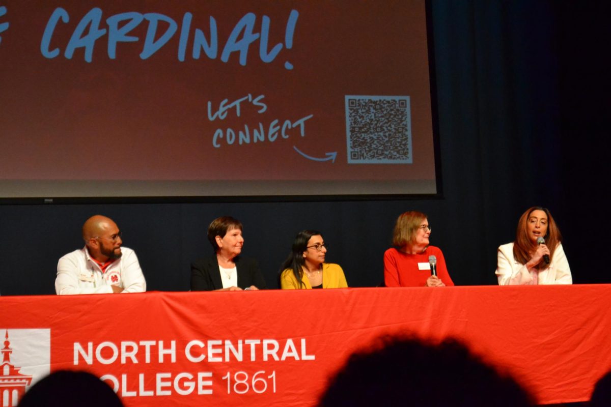 A panel of faculty and staff members answers questions during the open house event. 