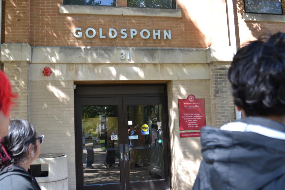 AVID students walk past the Goldspohn building, a lecture hall, on the tour of North Centrals campus. 