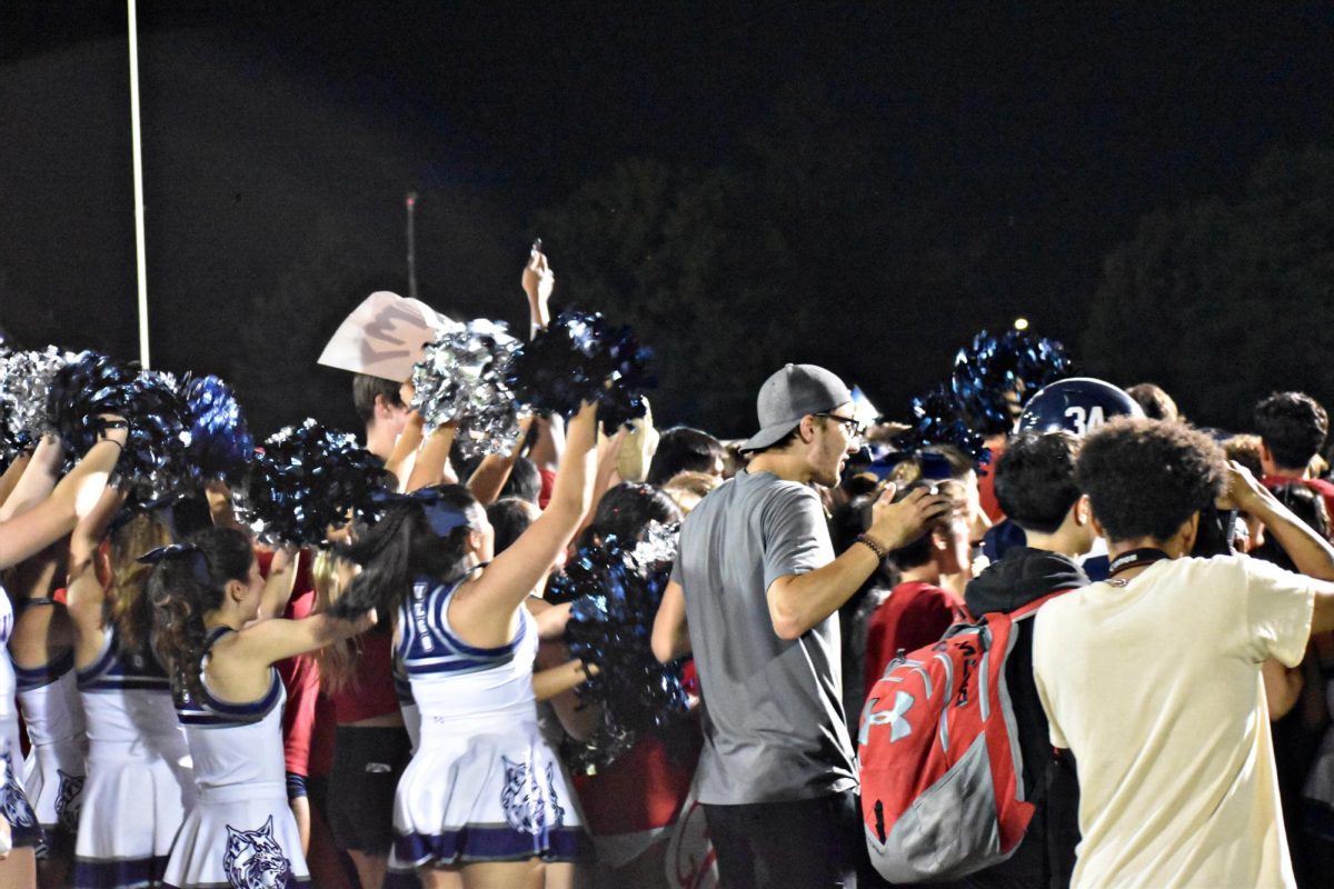 The crowd mobbed the players, shouting and cheering in excitement, when West Chicago defeated the Bartlett Hawks on Sept. 1. 