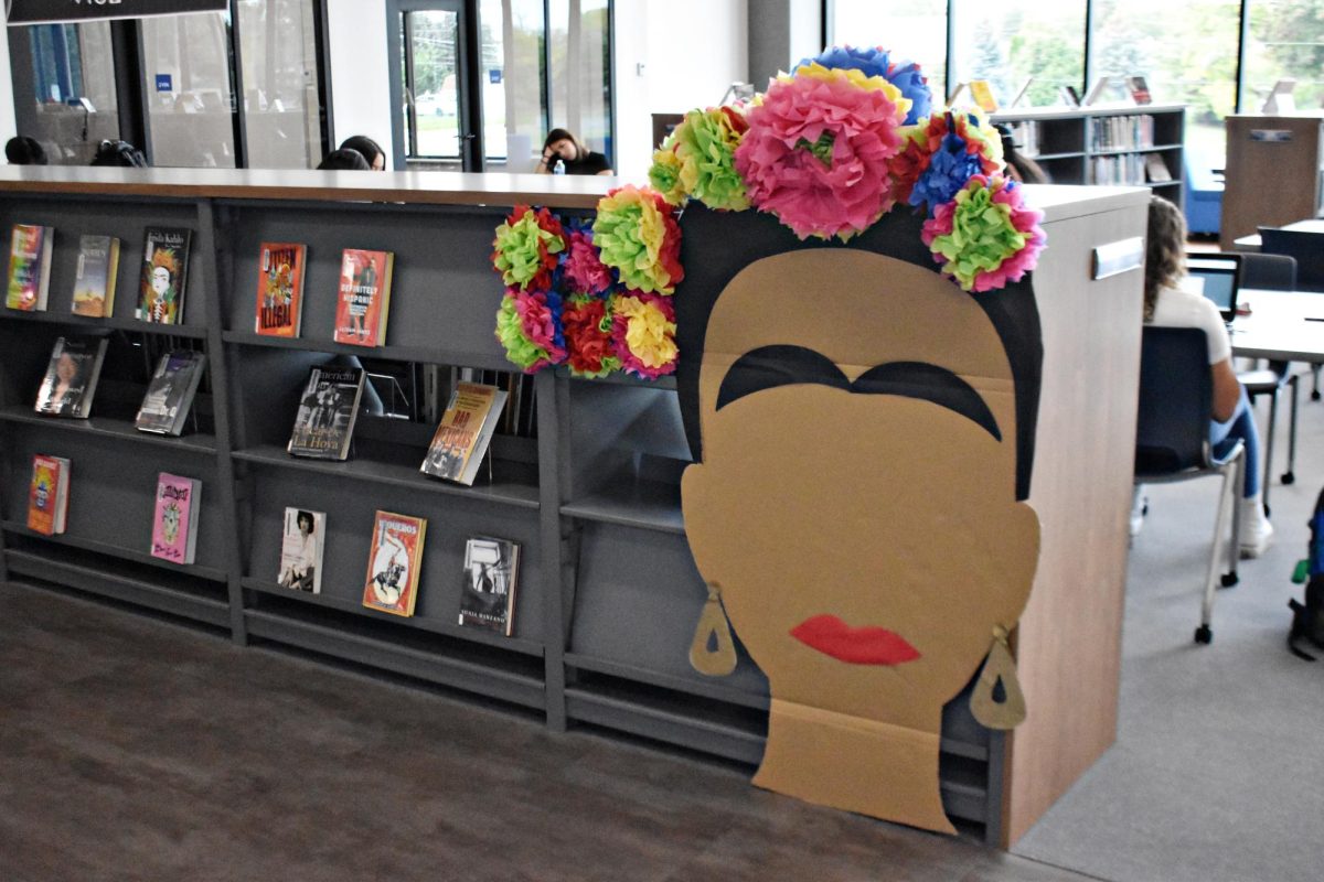 Students+who+wished+to+add+to+Frida+Kahlos+headpiece+could+do+so+by+taking+tissue+paper+supplied+by+the+LRC+and+creating+their+own+flowers.