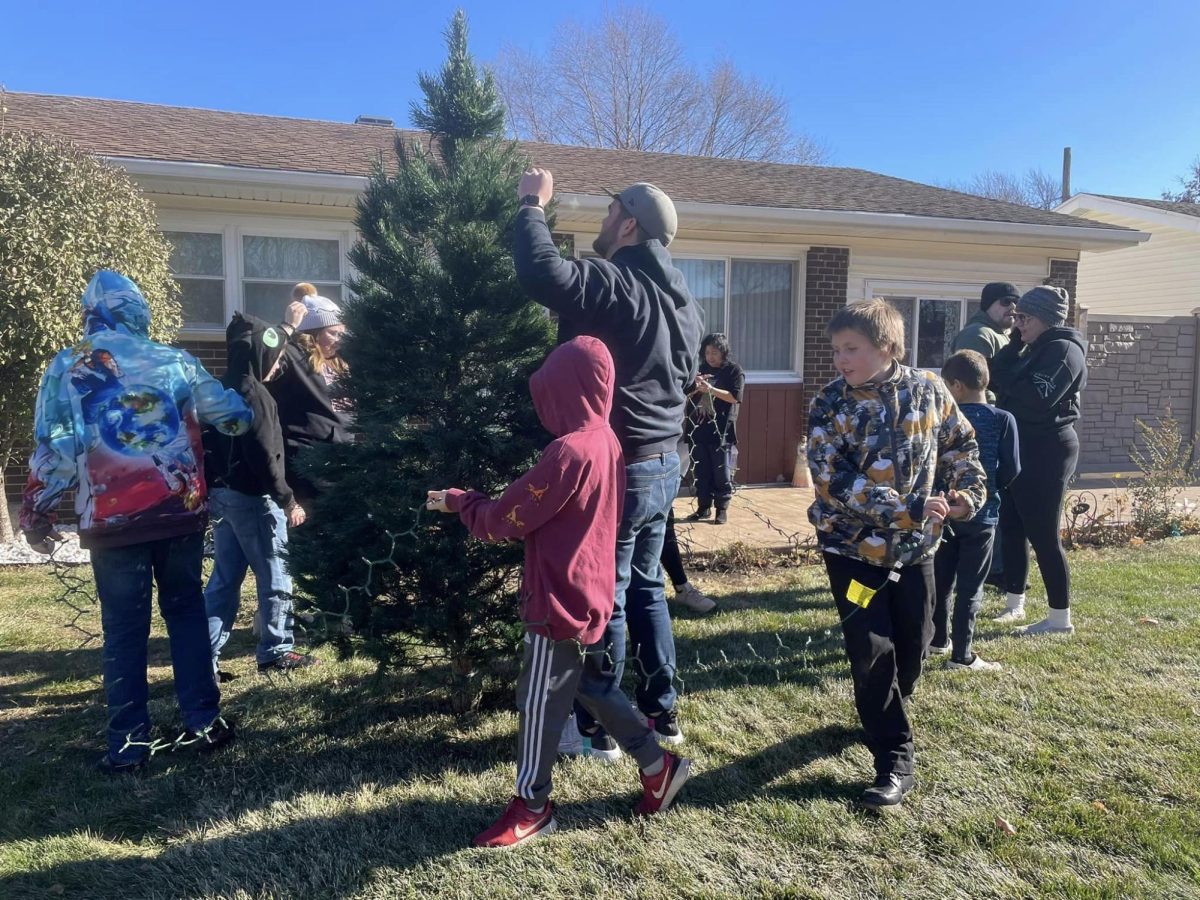 Volunteers work to string lights on one of Brittanys Trees delivered during November 2023. (Photo courtesy of Jim Guthrie)