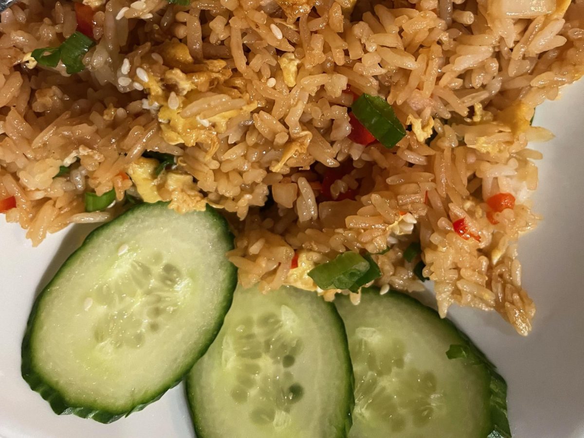 The+fried+rice+is+served+with+a+side+of+cucumber+at+Bonchon+in+Naperville.