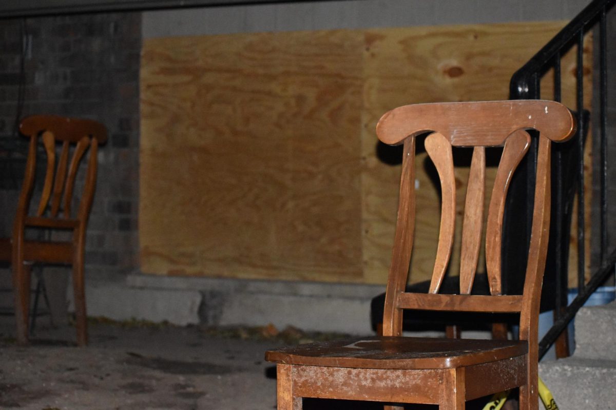 Two+salvaged+chairs+remain+in+the+entryway+of+the+Main+Park+apartment+complex+following+a+fire+that+displaced+over+100+people+on+Nov.+30.