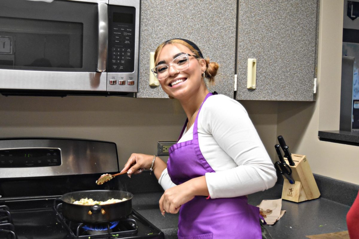 Sophomore Jasmine Arces-Romero supervises the wok.