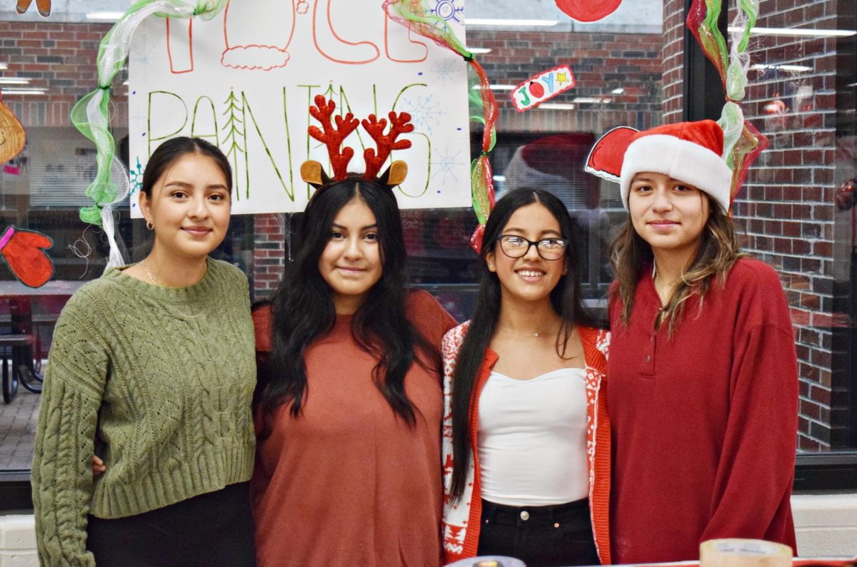 Members of Art Club and NHS combined to offer face painting at Breakfast with Santa on Dec. 9 in Commons.