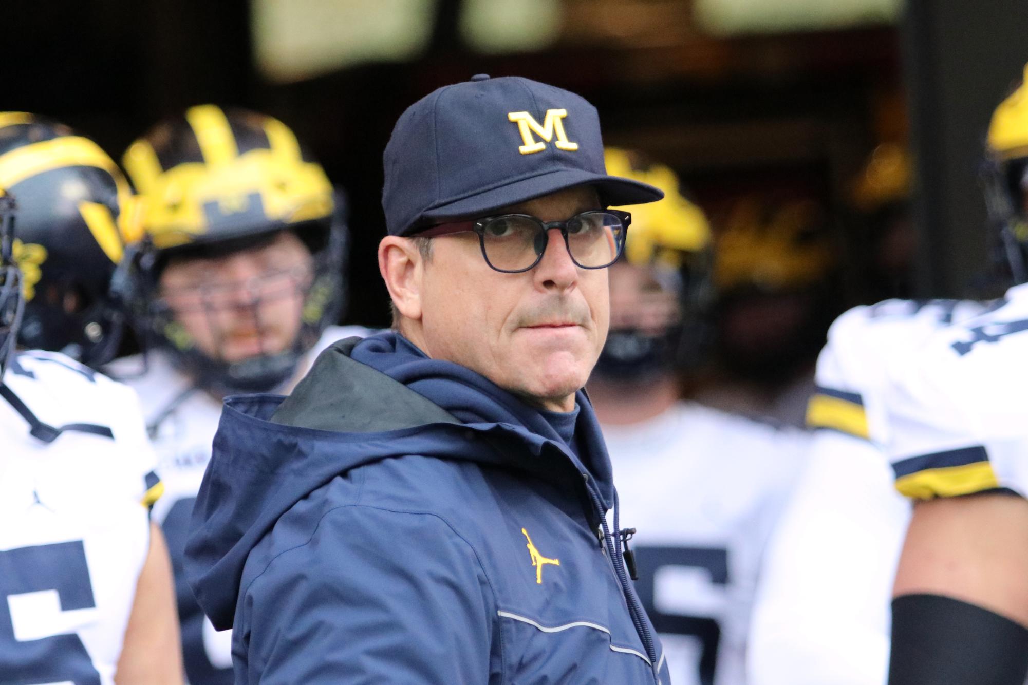 Coach Jim Harbaugh has led the Michigan Wolverines for numerous seasons, but found himself suspended this year for three games. (Royalty-free photo courtesy of Maize & Blue Nation via Wikimedia Commons)