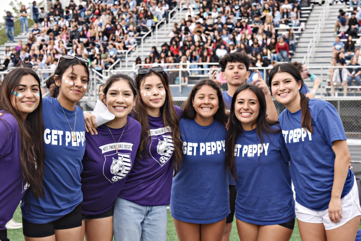 Pep Club seniors work the crowd in between pep assembly games on Sept. 29.