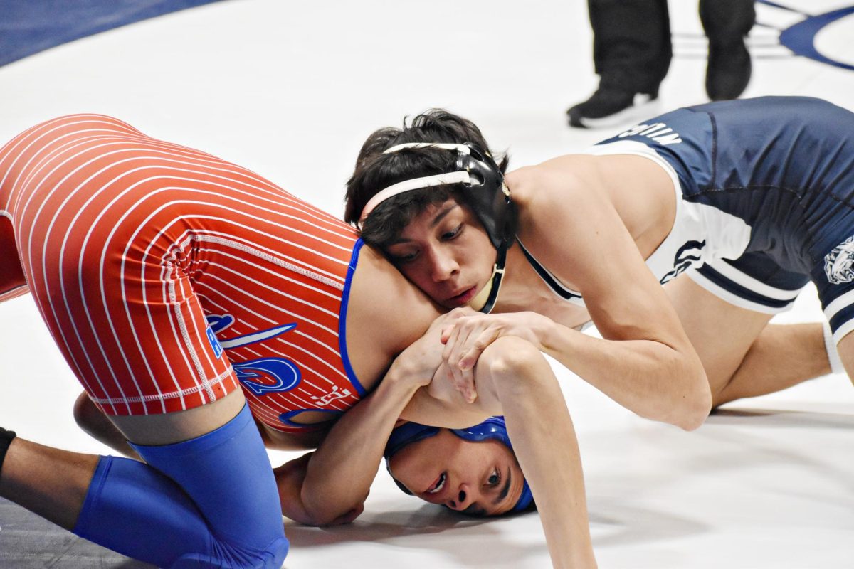 The boys wrestling team sparred against Glenbard South on Wednesday, Dec. 13 at home.