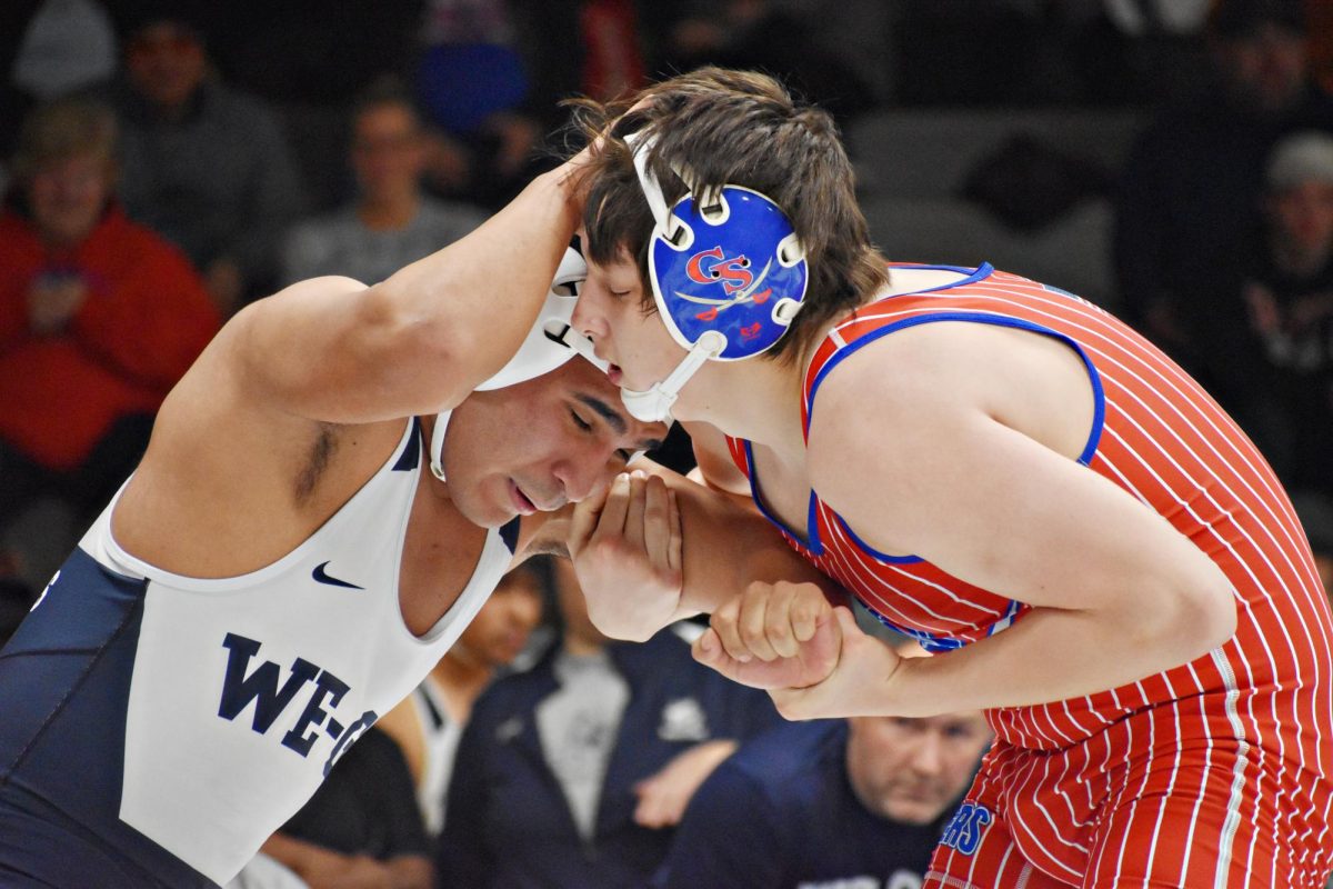 Alan Munoz goes head-to-head with a wrestler from Glenbard South.