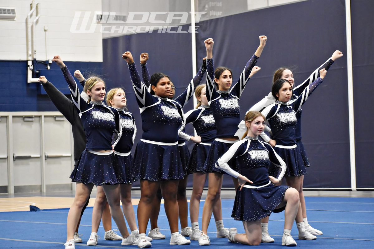 The cheer team performs for its upcoming meet during practice in the fieldhouse on Jan. 18 2024.