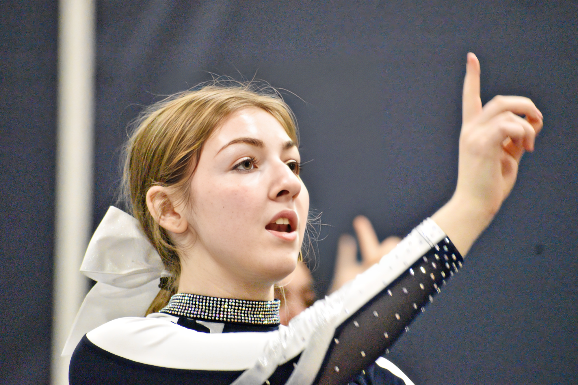 Julia Bloss cheers during practice. Bloss is a seasoned gymnast and dancer.