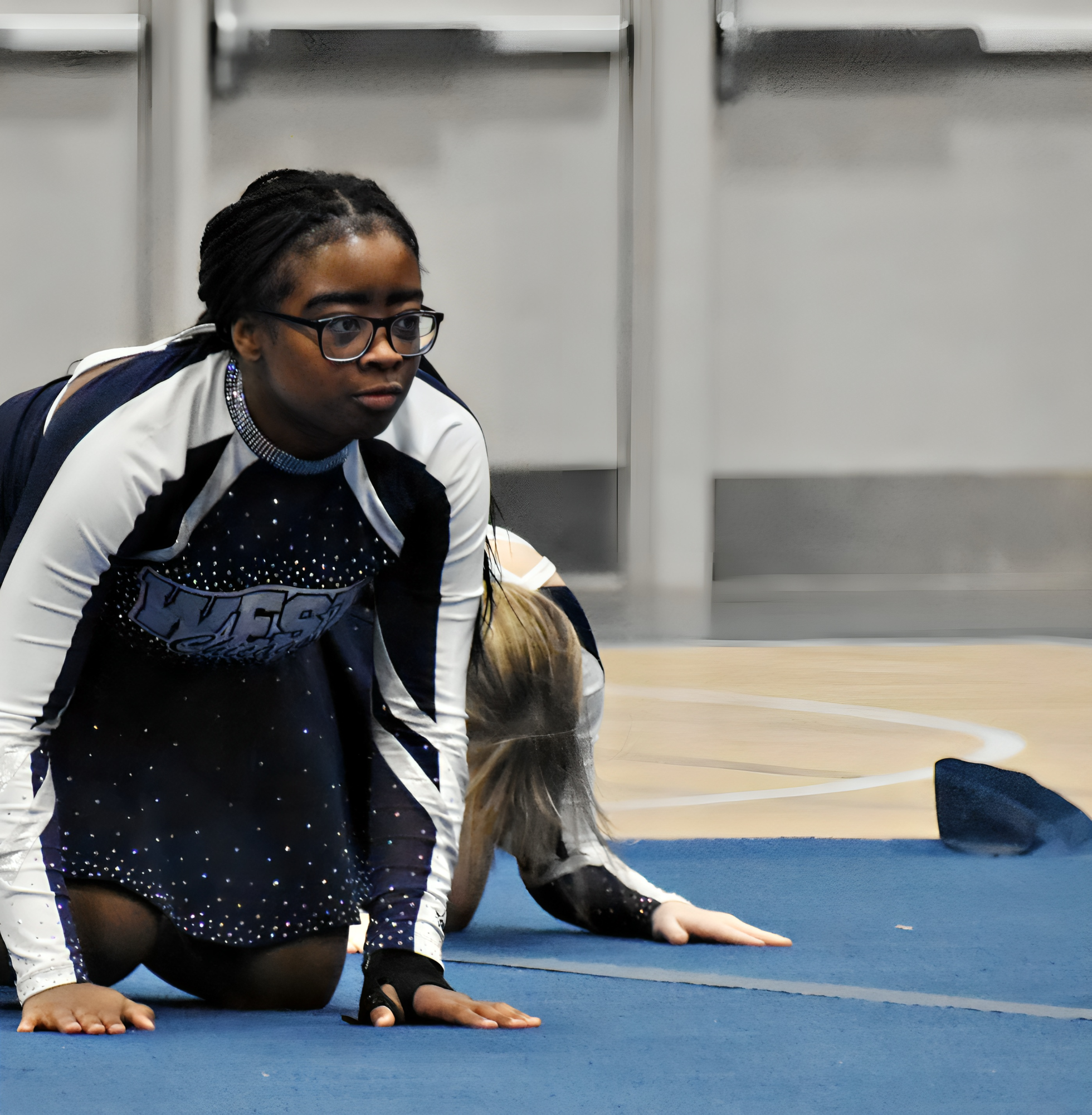 NyAra Tate awaits her cue on the mat during practice in January.