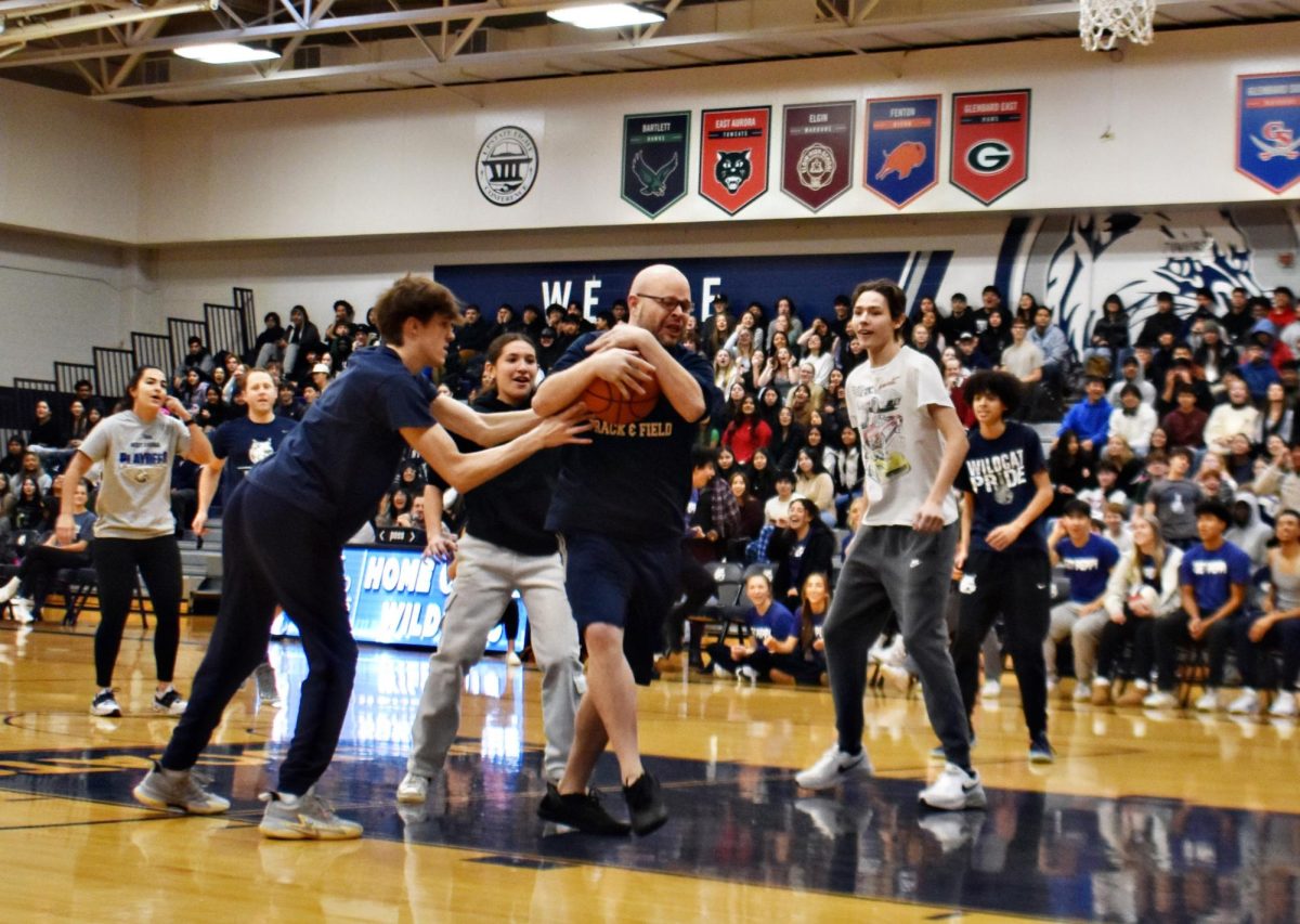 SPED teacher Tyler Belding hangs on tightly to the basketball. 