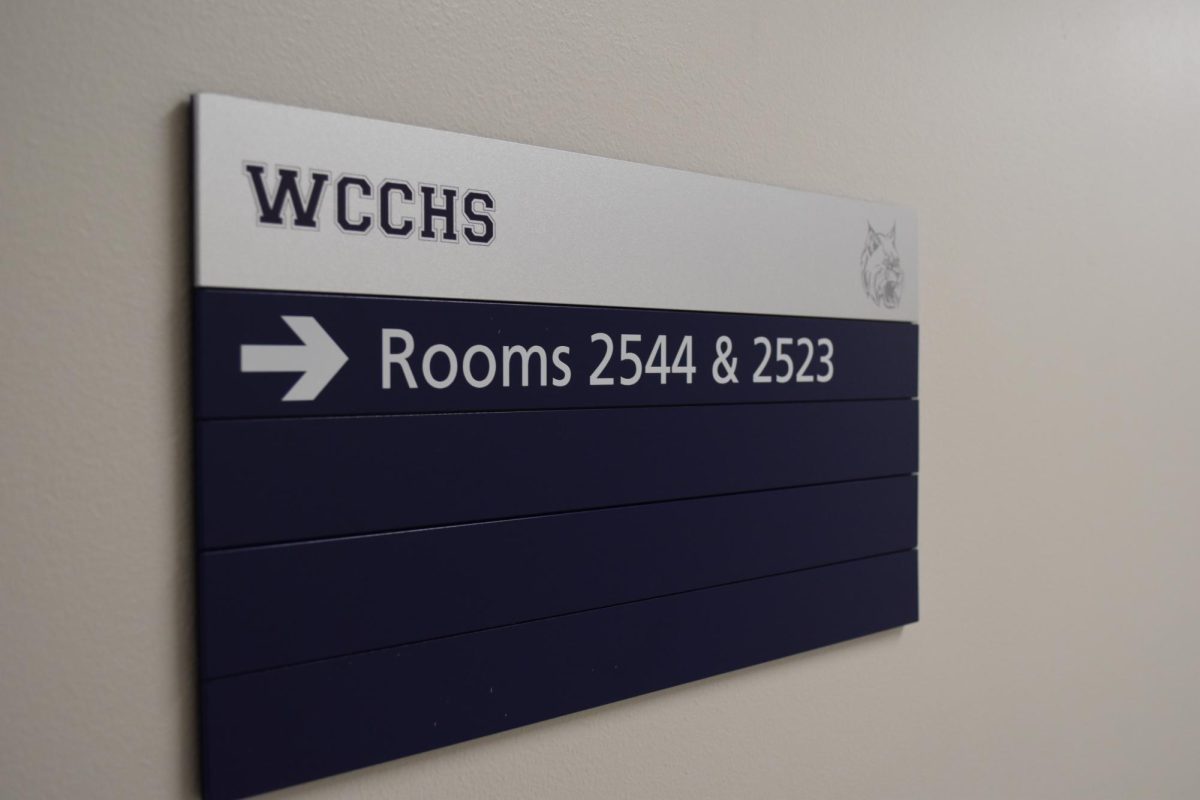 Signs, such as this one, have been installed in certain areas of the first and second floors. After the positive reception of them at the Board Meeting, they are likely to be expanded to all sections of the building.