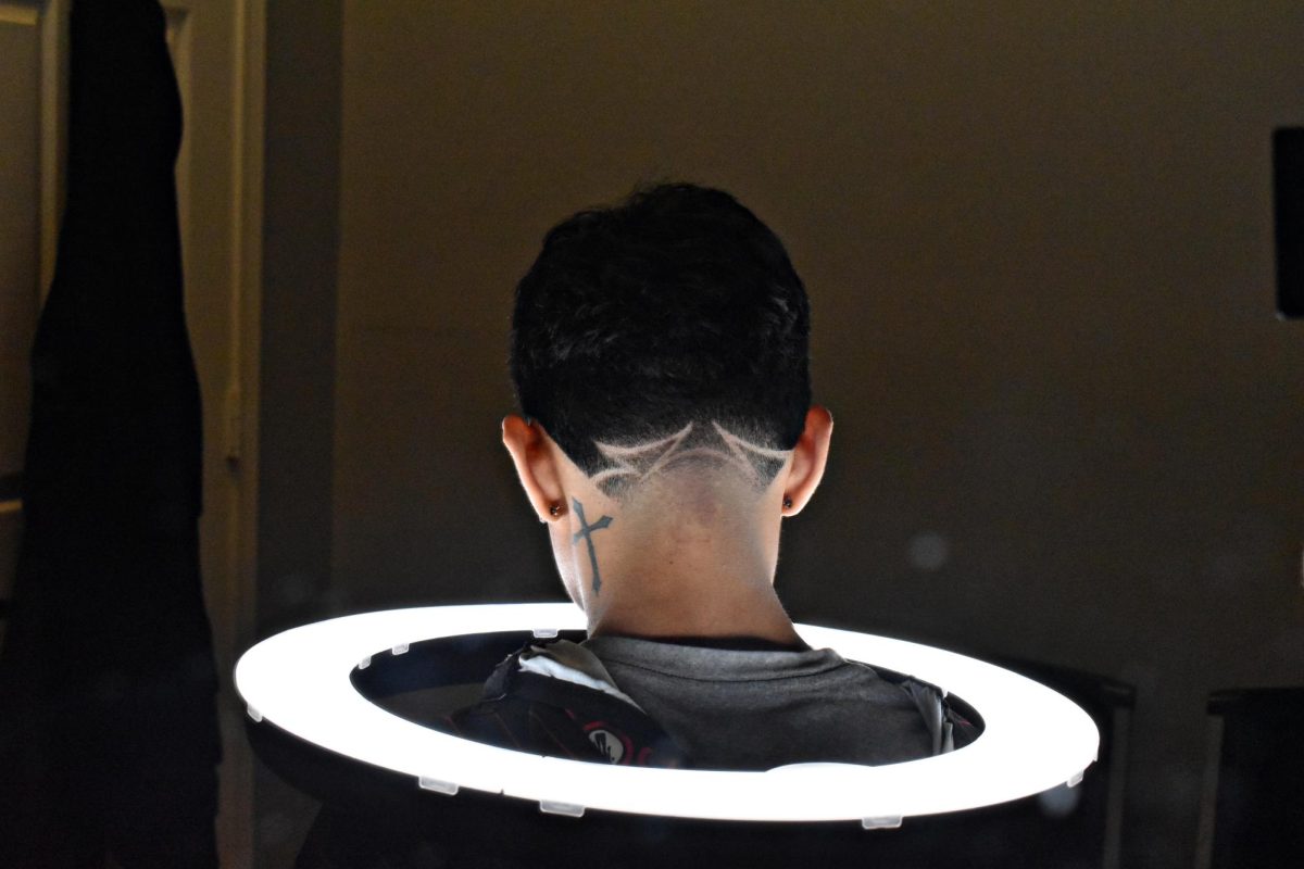 A ring light is often used for photography purposes - a barber who is trying to build his client base wants to take high-quality images of his work, and the ring light can help showcase the final product.