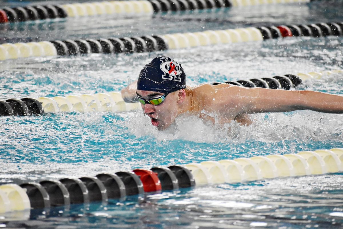 Junior and swimmer Nathan Lindstorm completes the butterfly stroke.