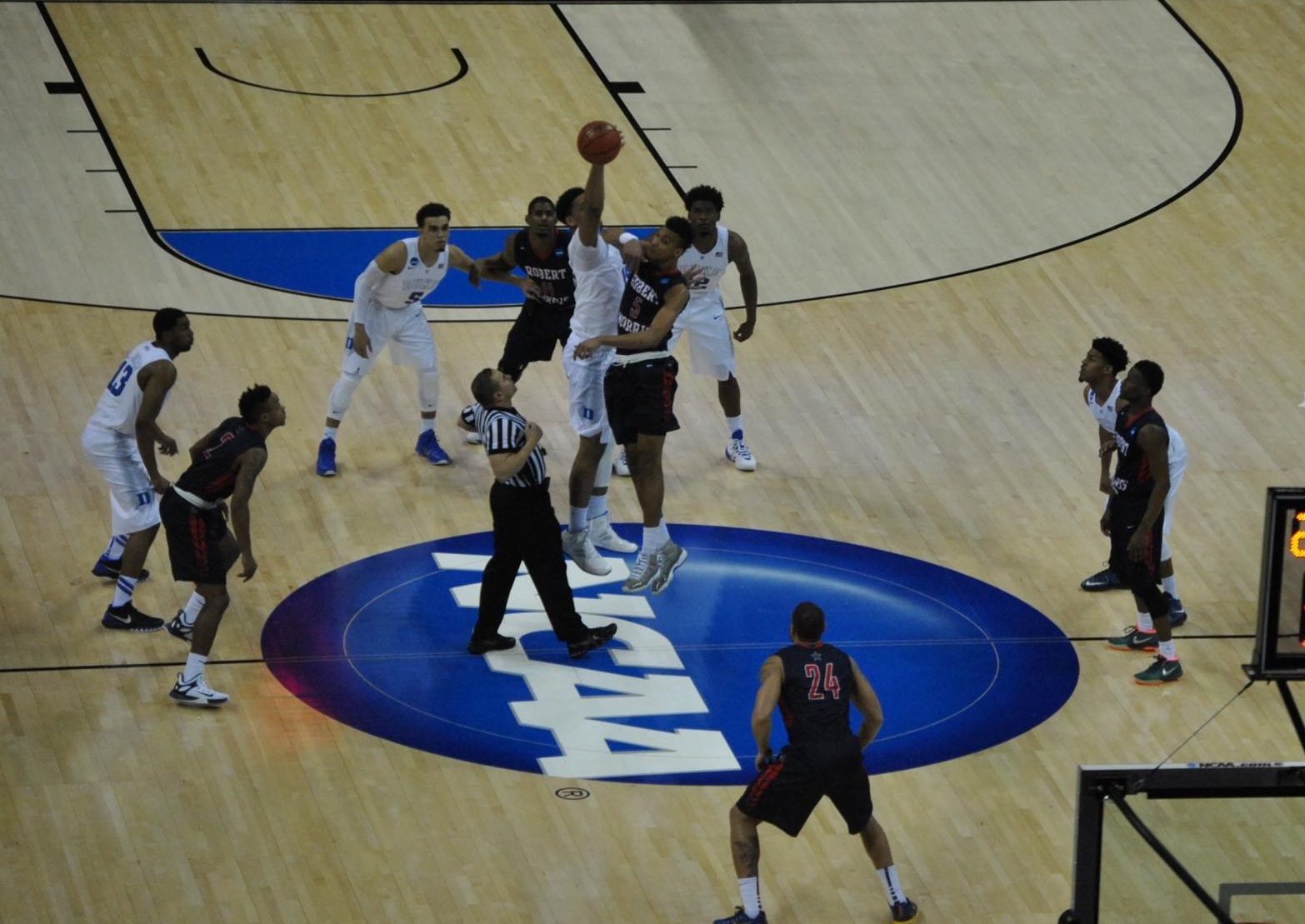 The Duke Blue Devils and the Robert Morris Colonials jump it up to start their second round NCAA Tournament game in Charlotte


