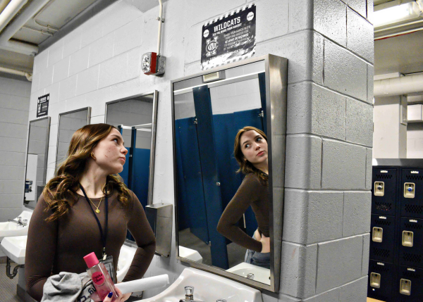 Notice the slant on the mirror in the locker room bathroom, allowing for a more flattering reflection.
